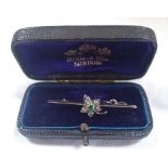 A 15CT GOLD, EMERALD AND DIAMOND BAR BROOCH by J.W. Benson in an original case, approximtely 3gms
