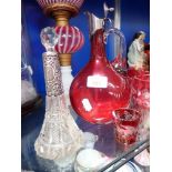 A 19TH CENTURY CRANBERRY GLASS CLARET JUG, with plated top, a Victorian silver topped scent bottle a