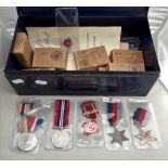 A COLLECTION OF VARIOUS MILITARY AND RED CROSS MEDALS IN A TIN BOX