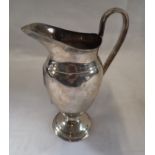 GOLDSMITH AND SILVERSMITH CO. SILVER JUG of baluster form approximately 200gms