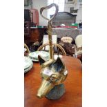 A 19TH CENTURY BRASS AND IRON DOOR STOP in the form of a fox's head with a riding crop handle, 38cm
