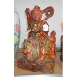 A CHINESE CARVED AND PAINTED WOOD MODEL OF A SEATED IMMORTAL, 40CM HIGH