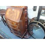 A REPRODUCTION MAHOGANY BUREAU of small proportions, 54cms wide, a demi lune table, lamp and other s