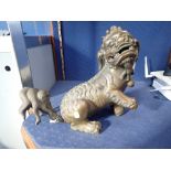 A LARGE CHINESE BRONZE TEMPLE LION, 31cm high