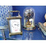 A BRASS CASED CARRIAGE CLOCK and a small anniversary clock (2)