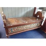 A CARVED AND PAINTED HARDWOOD CHEST with raised ends and openwork panels made from older fragments,