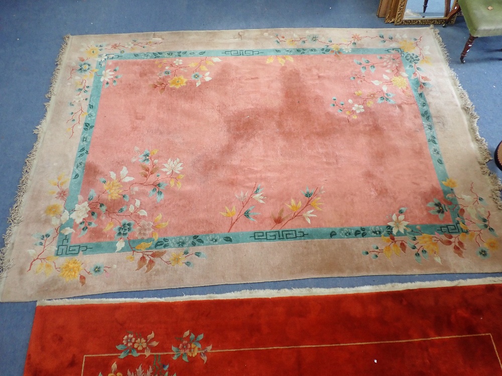 CHINESE STYLE MACHINE WOVEN WOOL CARPET, the rectangular pink field with floral and foliate sprigs a