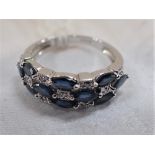 A SAPPHIRE AND DIAMOND DRESS RING, on a 18K white gold shank, ring size O