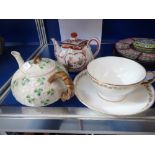A BELLEEK TEAPOT, a Japanese teapot and a 'Versailles' cup and saucer (examine) (3)