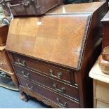 A 1920'S MAHOGANY BUREAU ON BALL AND CLAW FEET, 77cms wide