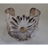 A TIFFANY & CO. MODERN STERLING SILVER BRACELET with Repousse Daisy Design, approximately 62gms