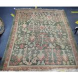 A GREEN GROUND 'ZIEGLER' TYPE RUG (insect damaged and faded) 133cm x 165cm