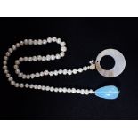 A CULTURED PEARL NECKLACE, with attached 'Quartz' pendant