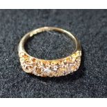 AN EDWARDIAN 18 CARAT GOLD FIVE STONE DIAMOND RING, the five graduated old brilliant cut diamonds, a