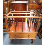 A VICTORIAN WALNUT CANTERBURY