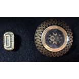 A 15CT YELLOW GOLD CIRCULAR LOCKET, approx 7.4grams, together with two brooches (3)