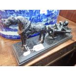 A 19TH CENTURY STYLE CAST IRON FIGURE OF A BEAR IN A HORSE DRAWN SLEIGH