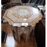 A MOORISH OCTAGONAL HARDWOOD AND BONE INLAID TABLE, 32cms dia.