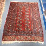 A RED GROUND PERSIAN RUG (frayed) 104cm x 135cm