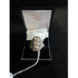 A DIAMOND AND WHITE SAPPHIRE CLUSTER RING, on an unmarked white and yellow metal shank, ring size V