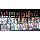 A COLLECTION OF MEDALS AND RIBBONS, to include "The African Star" and "The Defence Medal" 1939-1945