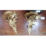 A PAIR OF CARVED AND GILTWOOD FLORENTINE WALL BRACKETS, 17cms wide