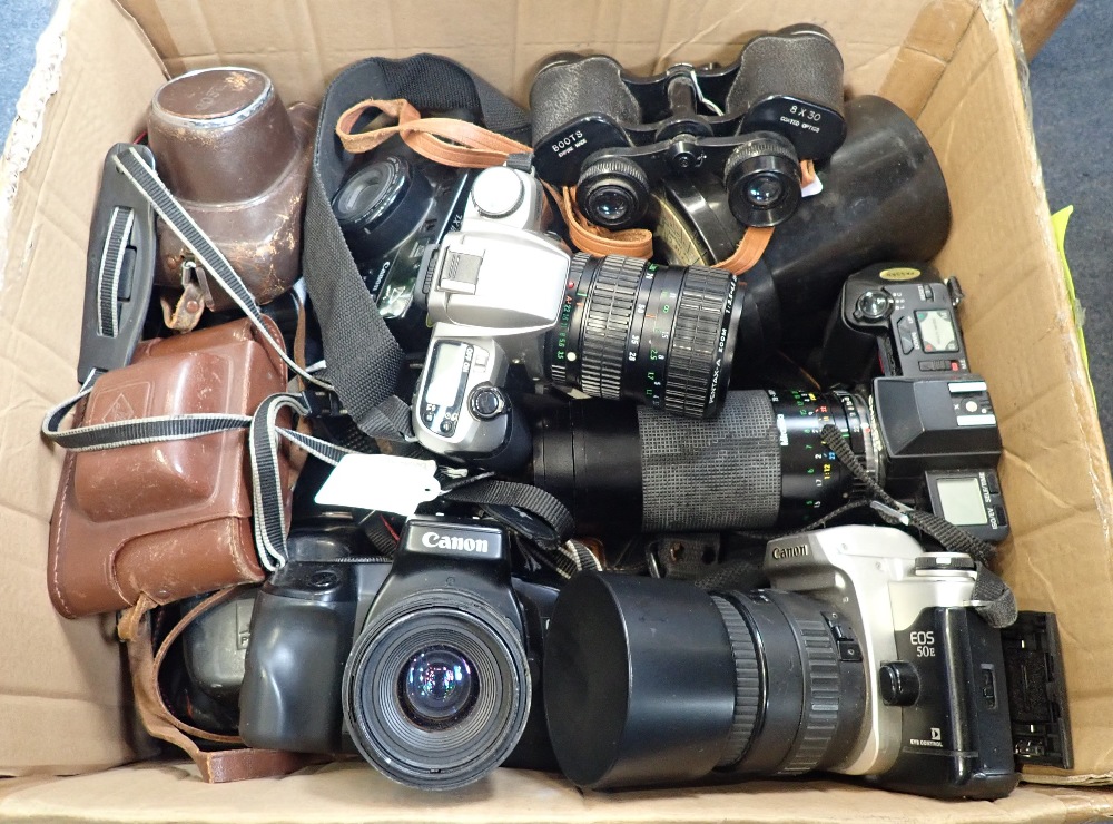 A COLLECTION OF CAMERAS and optics, to include a Canon EOS