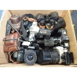 A COLLECTION OF CAMERAS and optics, to include a Canon EOS