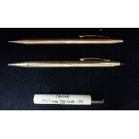 CROSS A 14K GOLD FILLED PROPELLING PENCIL, together with one other and spare leads, in a "Cross" pre