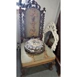 A VICTORIAN CARVED WALNUT AND TAPESTRY UPHOLSTERED LOW CHAIR