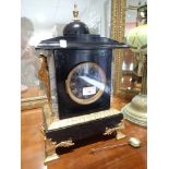 AN EBONISED AND GILT METAL BRACKET CLOCK