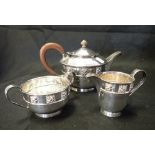 AN ARTS AND CRAFTS SILVER PLATE TEASET