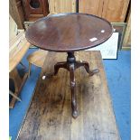 A GEORGE III MAHOGANY DISHED TOP TRIPOD OCCASIONAL TABLE