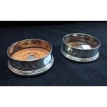 A PAIR OF SILVER WINE COASTERS