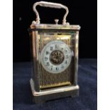 AN EDWARDIAN BRASS CASED CARRIAGE CLOCK