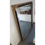 A PAINTED AND COMPOSITION FRAMED RECTANGULAR WALL MIRROR