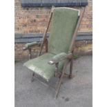 A VINTAGE ADJUSTABLE TEAK FRAMED GARDEN ARMCHAIR