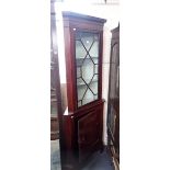 AN EDWARDIAN MAHOGANY GLAZED CORNER CABINET WITH CUPBOARD BELOW