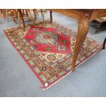 A RED GROUND IRANIAN RUG