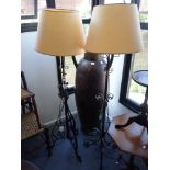 A PAIR OF WROUGHT IRON STANDARD LAMPS