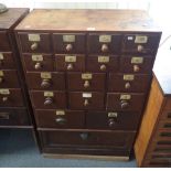 A STAINED HARDWOOD AND PINE CHEMISTS' SHOP CHEST OF DRAWERS