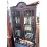 A 1920S OAK BOOKCASE ON BARLEY TWIST LEGS