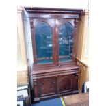 A VICTORIAN MAHOGANY LIBRARY BOOKCASE, THE GLAZED UPPER SECTION CONVERTED TO HOLD GUNS