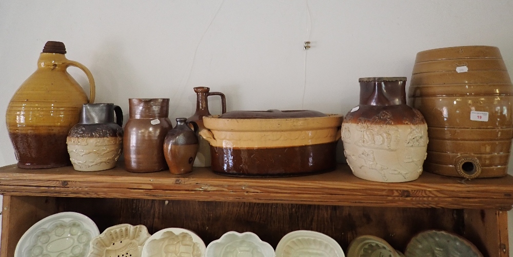 A COLLECTION OF EARTHENWARE JUGS AND DISHES