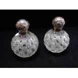 A CUT GLASS PERFUME BOTTLES WITH SILVER LID