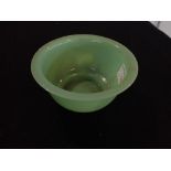 A GREEN GLASS BOWL