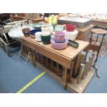 A VICTORIAN STRIPPED PINE KITCHEN TABLE WITH DROP FLAPS