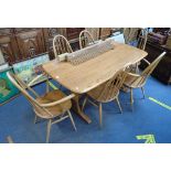 ERCOL, A PALE ELM DINING TABLE AND SIX CHAIRS