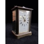 AN EDWARDIAN BRASS CASED CARRIAGE CLOCK