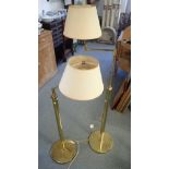 A PAIR OF BRASS ADJUSTABLE STANDARD LAMPS